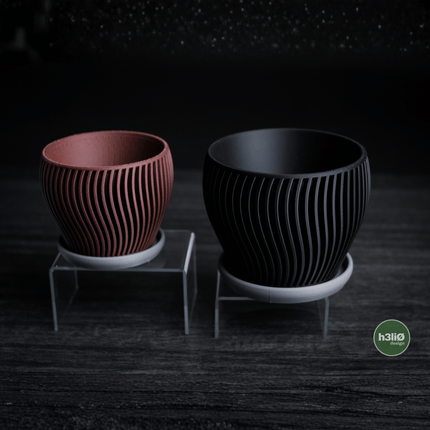 Elvo | ghiveci decorativ cu formă fluidă și bază integrată