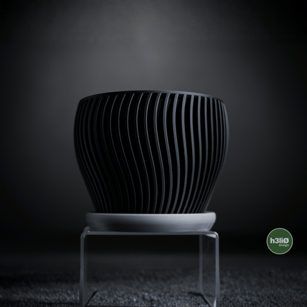 Elvo | ghiveci decorativ cu formă fluidă și bază integrată