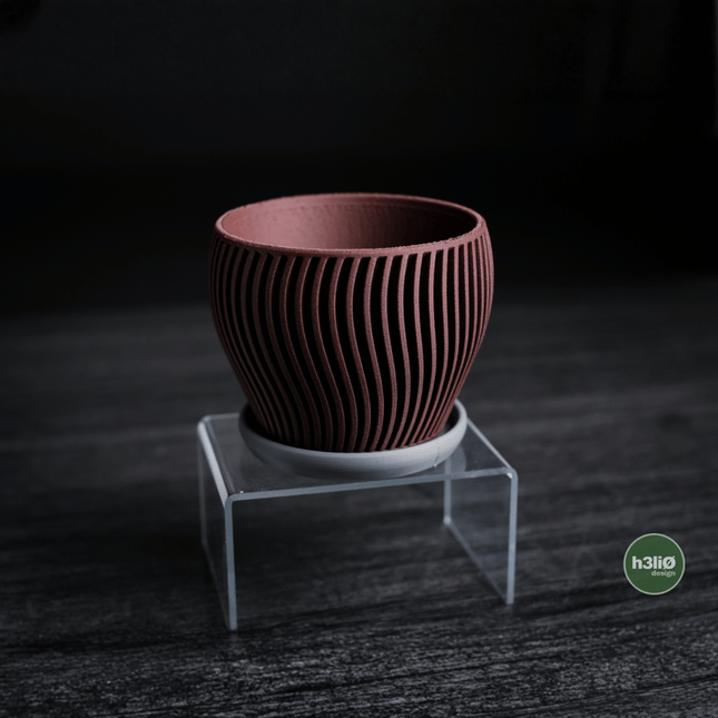 Elvo | ghiveci decorativ cu formă fluidă și bază integrată